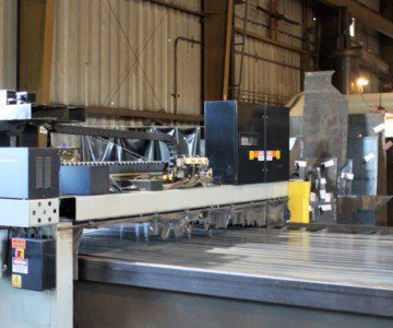 steel fabrication warehouse with robot cutting with a waterjet